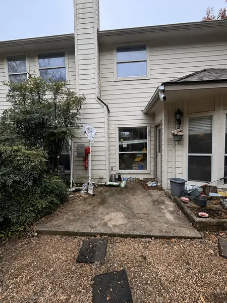 Bare concrete back-entrance slab before patio cover installation — CertiPro project, DFW