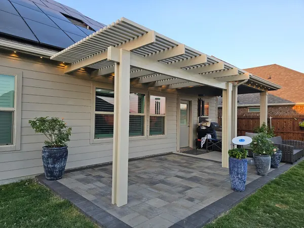 Lattice patio cover with recessed lighting over a paver patio — CertiPro project, DFW