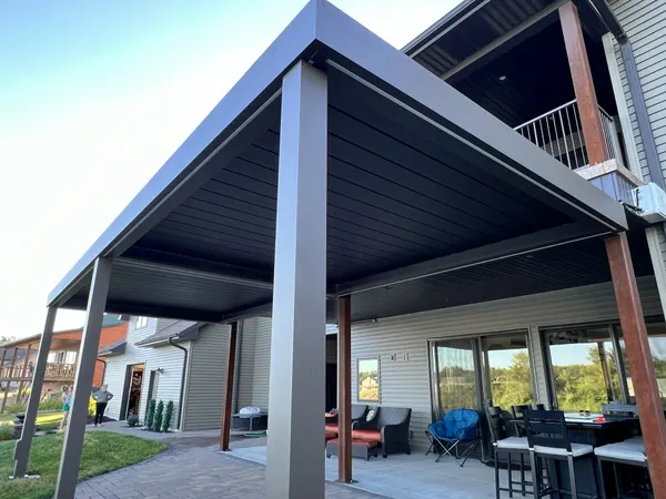 Modern charcoal louvered patio cover with steel posts — CertiPro project