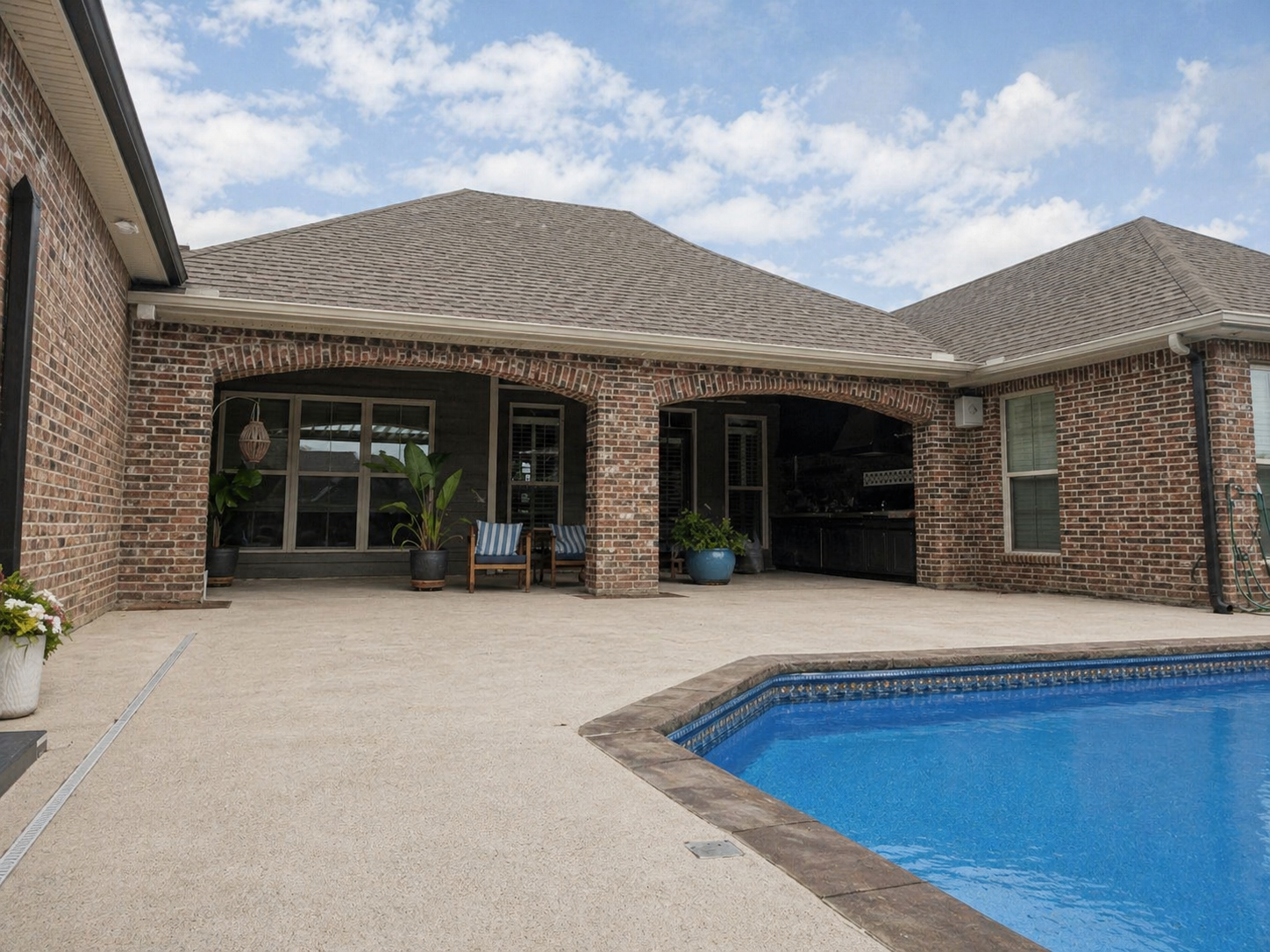 Bare poolside patio before install