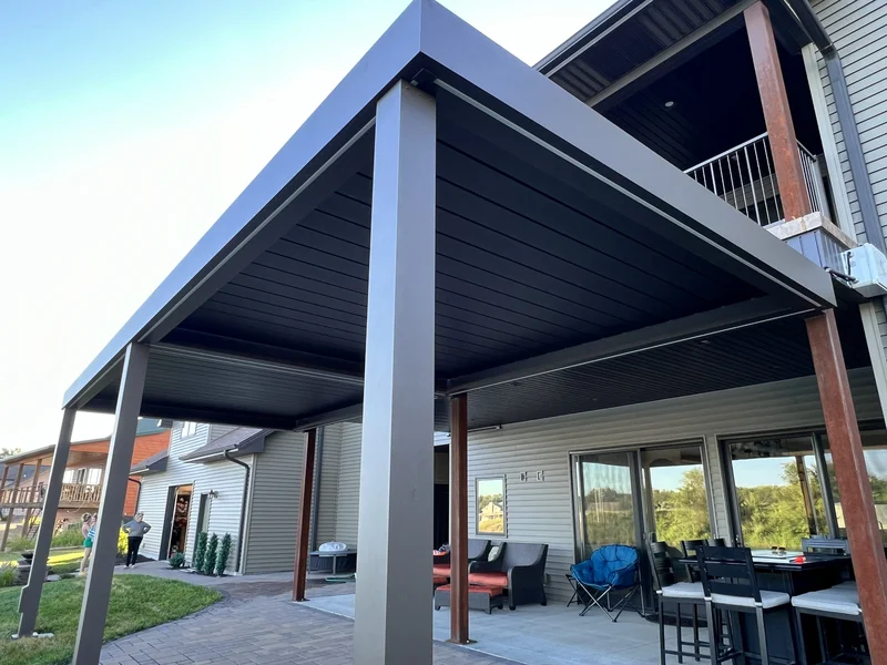 Modern dark aluminum patio cover with wood accents — Fort Worth