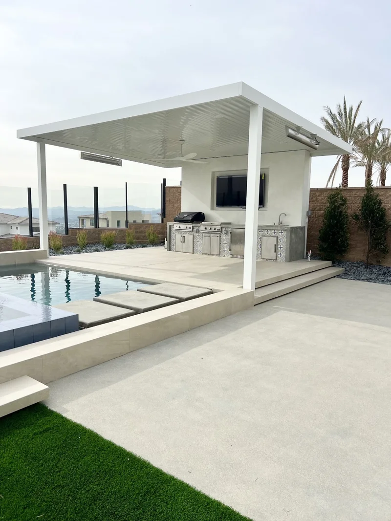 Outdoor kitchen with insulated patio cover and pool — Fort Worth, TX